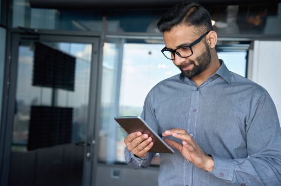 man-reading-tablet