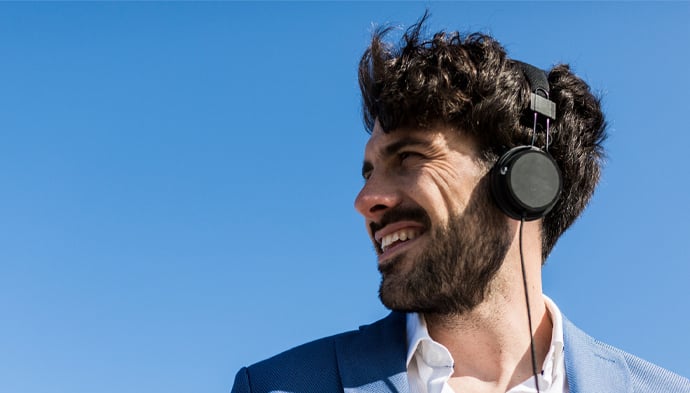 man-with-headphones-690x393